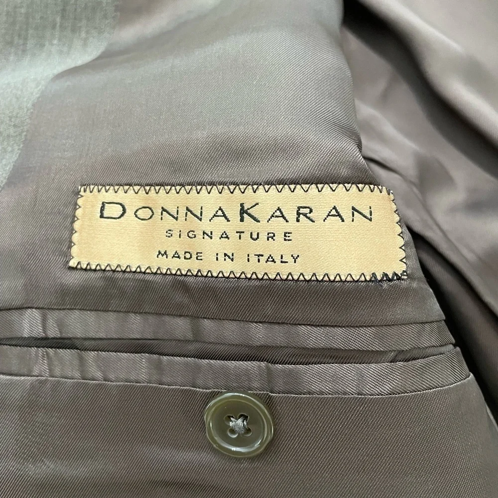Donna Karen Signature men’s 100% wool suit made in Italy. Long and olive color